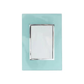Placa armada Sanelec Venecia Aqua con apagador sencillo, diseño en color azul claro y marco cromado para exteriores.